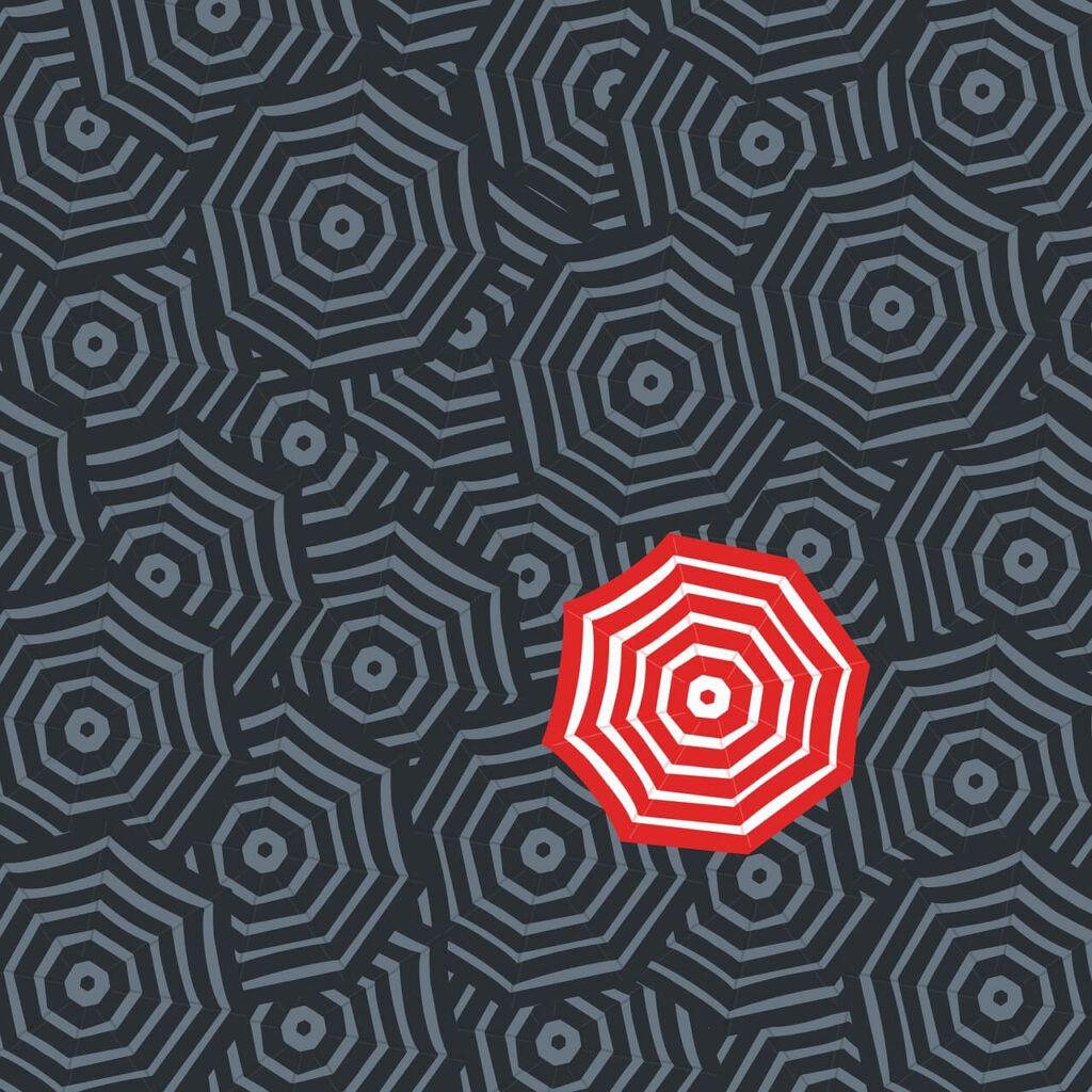 Illustration to represent programmatic audience targeting. One umbrella is red while all others are grey.